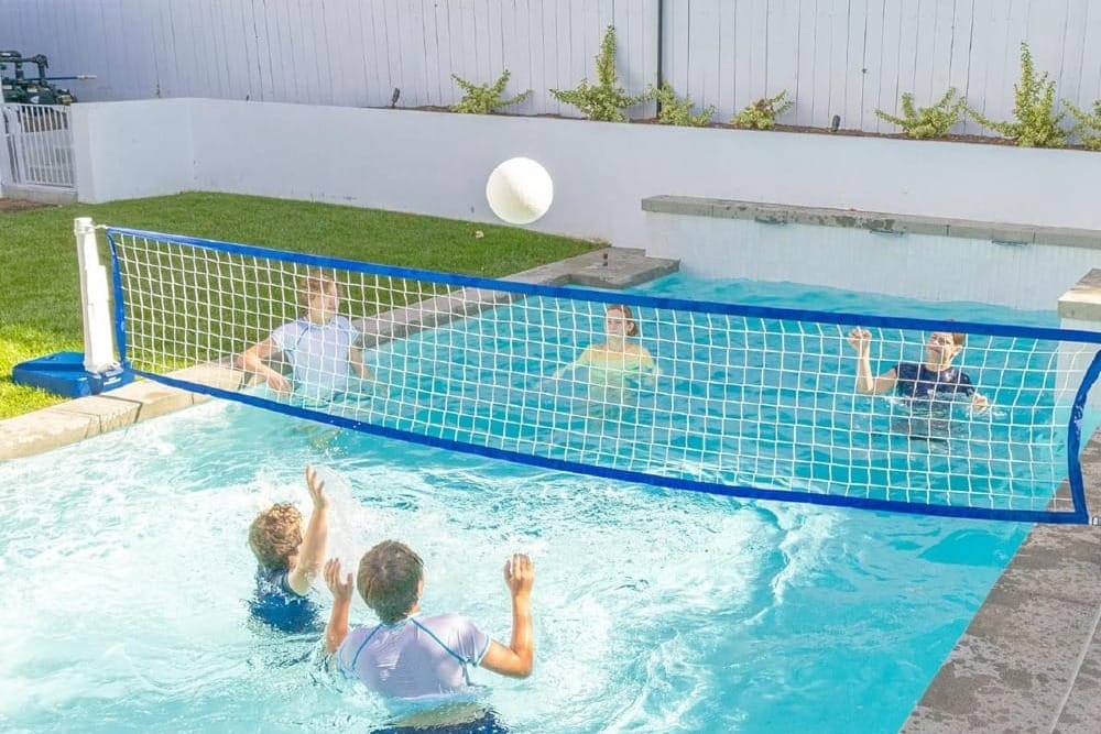 pool party games like pool basketball, pool noodle races and water volleyball